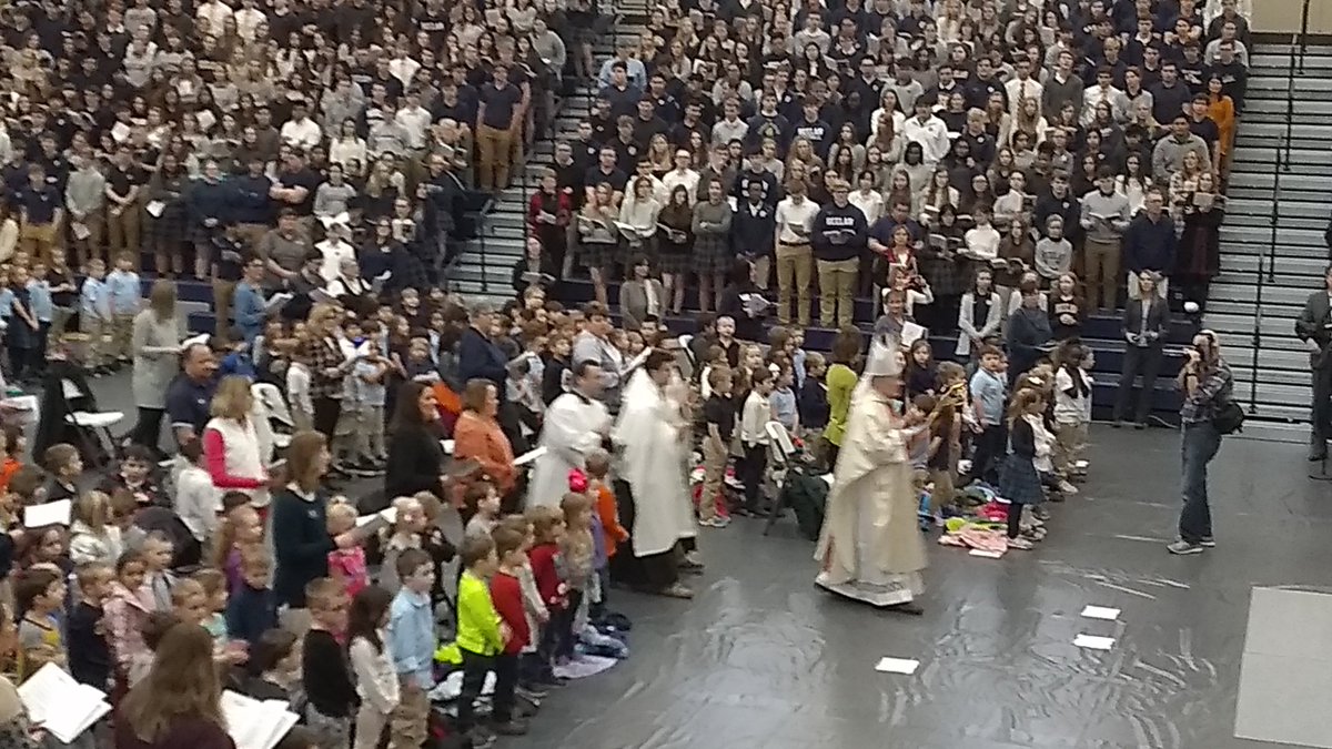 Bishop Nickless processes in for Mass at Bishop Heelan in new gymnasium.  About 1600 students gathered.  #CSW2020