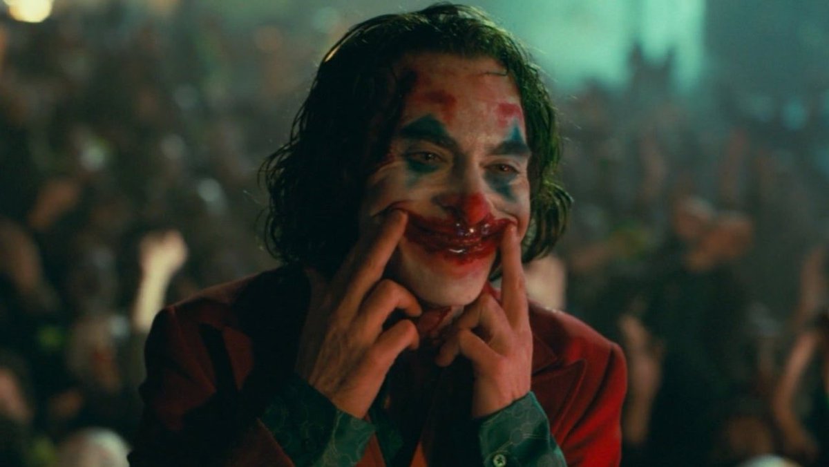 From this point forward Joker, now Magician, brings things about. Doesn’t just fantasize. The murder of the fat clown frenemy could be seen also as being painted red since so much blood. Violent acts before then were off camera or in self defense. 9/