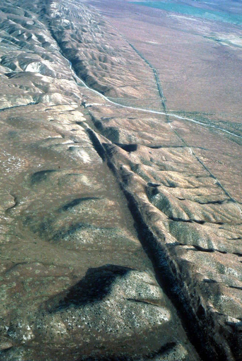San Andreas Fault, Carrizo Plain, California. Southeast along the San Andreas Fault. In the foreground, the block on the west side of the fault (right) has been raised relative to the block on the east side damming drainage from the hills to the east. 
