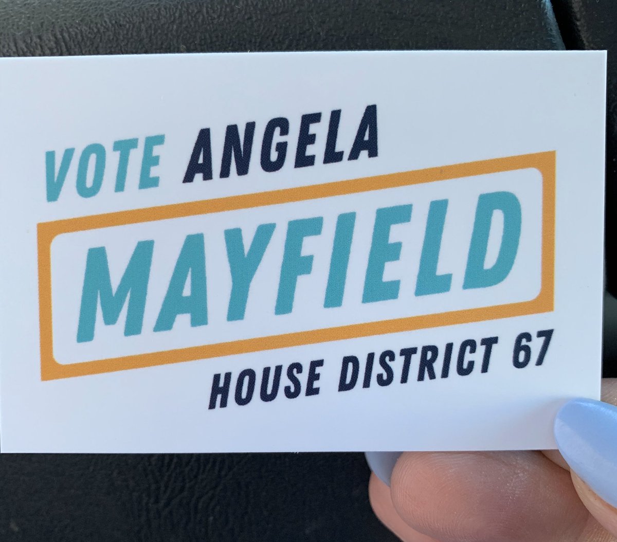 Business card showing logo in turquoise, gold, and indigo.