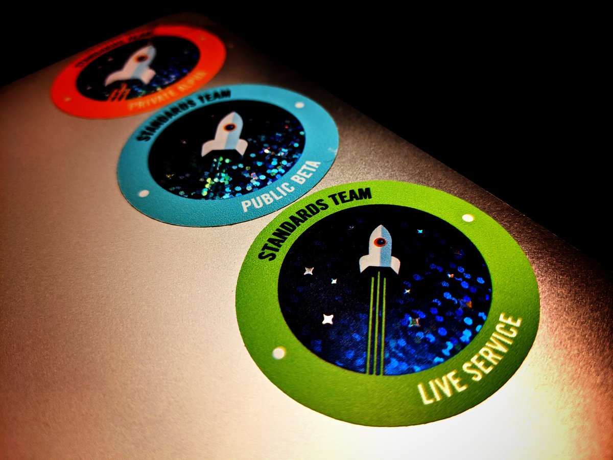 Photograph of 3 stickers on a laptop cover