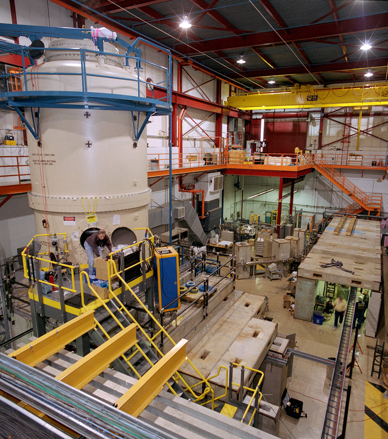 A large white structure in a warehouse-like environment.