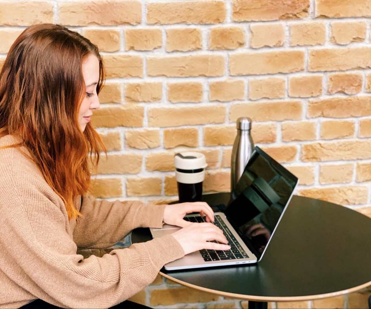 Helen Oswell typing on a laptop.