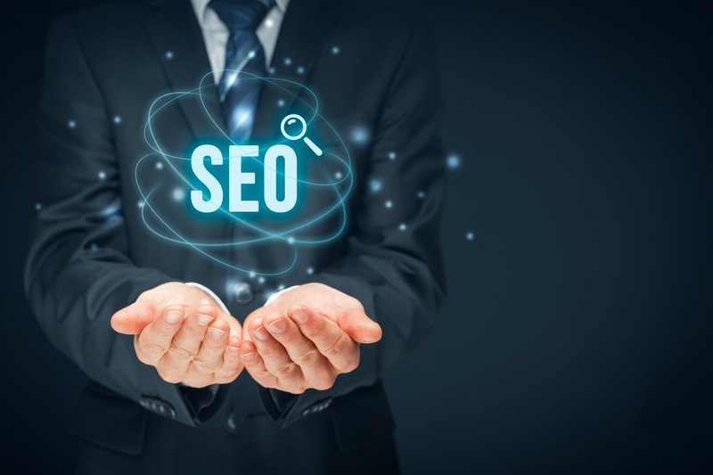 Businessman with graphic saying "SEO"
