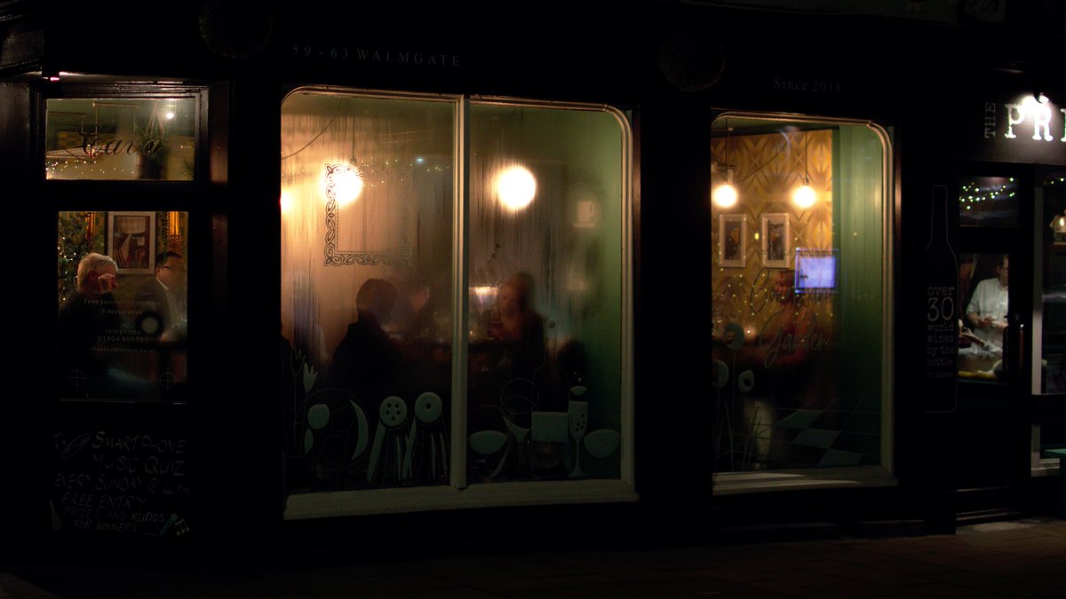 The same restaurant viewed more closely; 5 people can be seen in 5 windows