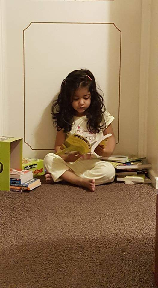 ravisaini_10's tweet image. Avni was 2 when this photo was taken. Sitting outside her brother's bedroom was her favourite place to look at books. Not the picture books we had bought for her, she wanted his 'Horrible Science' books because she wanted to be like Jay. #ReadingForPleasure #Books #SocialReader