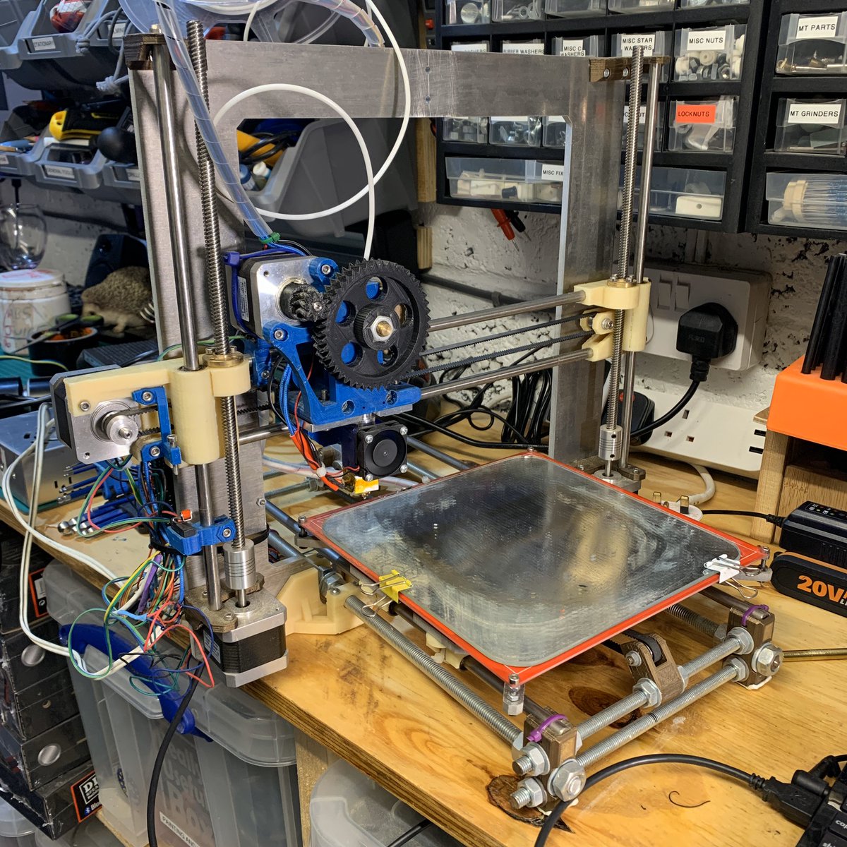 TheWoodgineer's tweet photo. Ikea mirror tile print bed, innovative cable tidy system and a wooden endstop. Yup this is my old i3 Prusa and I’m going to have some fun with it soon! 🤠#3dprinting #prusai3 #prusa #printerhacking https://t.co/D7gLKDPb3C