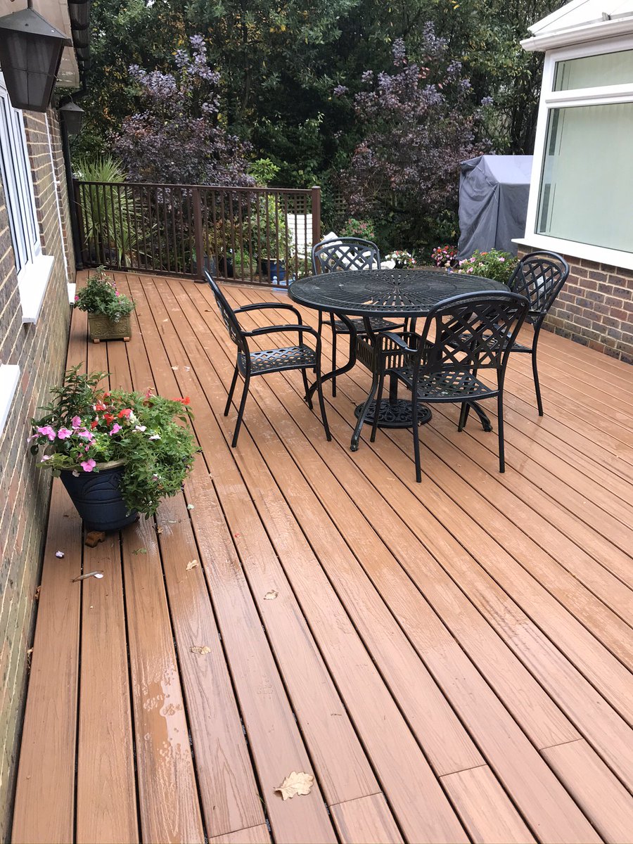 BuckinghamsLand's tweet image. From an old tired decking to a bright spacious area ready for entertaining. Completed in @trexcompany tiki torch composite decking with a bronze hand rail. #hardlandscaping #hardlandscapingspecialists #composite #decking #gardendesign