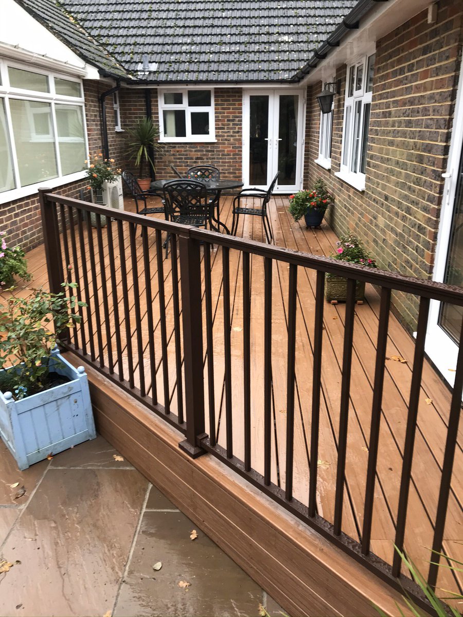 BuckinghamsLand's tweet image. From an old tired decking to a bright spacious area ready for entertaining. Completed in @trexcompany tiki torch composite decking with a bronze hand rail. #hardlandscaping #hardlandscapingspecialists #composite #decking #gardendesign