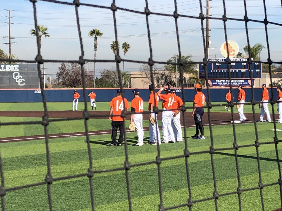KyleAGlaser's tweet photo. OCC players are all warming up wearing Altobelli’s No. 14. The shirts say #foreverapirate on the front and the names John, Keri, Alyssa on the right sleeve https://t.co/wlkfc9zqoh