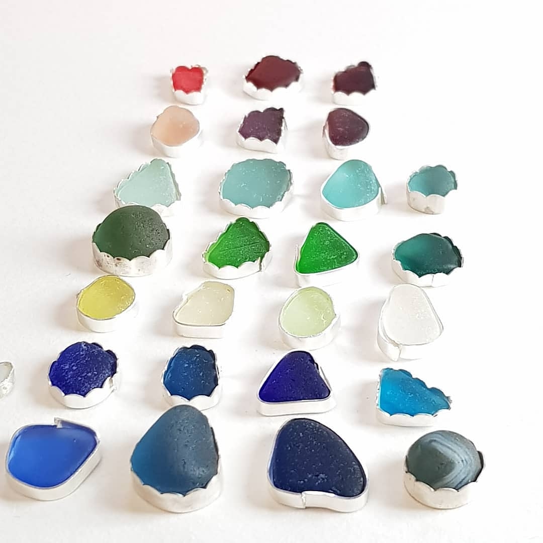 This was the to do pile! I've also found a cute half a marble to try!  #mikeadamjewelry #makingrings #seaglassrings #seaglassrainbow #seamarble #redseaglass #blueseaglass #greenseaglass #greenseaglass #yellowseaglass #aquaseaglass #tealseaglass #purpleseaglass #pinkseaglass