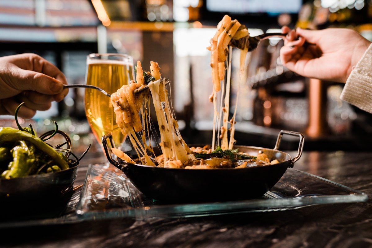 What did we do to deserve melted cheese? 🧀 #blessed 
📸: Poutine with seasoned fries, lamb &amp; ale gravy, cheddar curds, and fried sage.