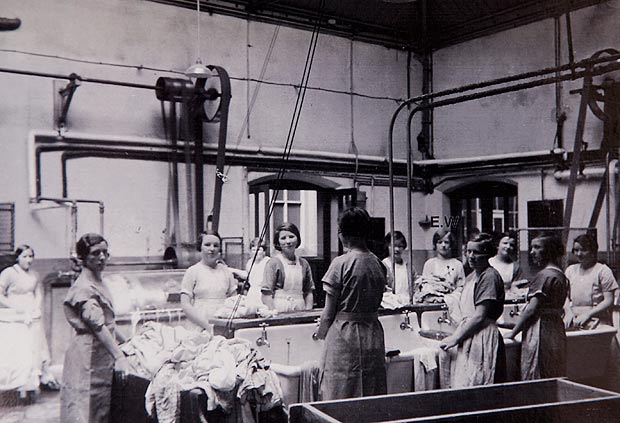 photo of women working in the laundry room of a Magdalene before WW2