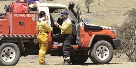 Image of Bronte and her dad next to a firetruck