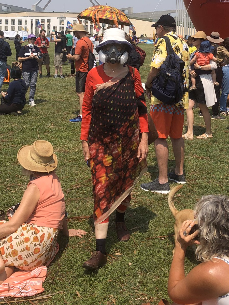 Julian_Wigley's tweet photo. Moments on the grass #PeoplesClimateAssembly #Feb4FireFury Canberra Parliament rally. 

People adapting🙃 mourning loss, thanking the firies and taking action for change.
#auspol https://t.co/CycADD1sX2