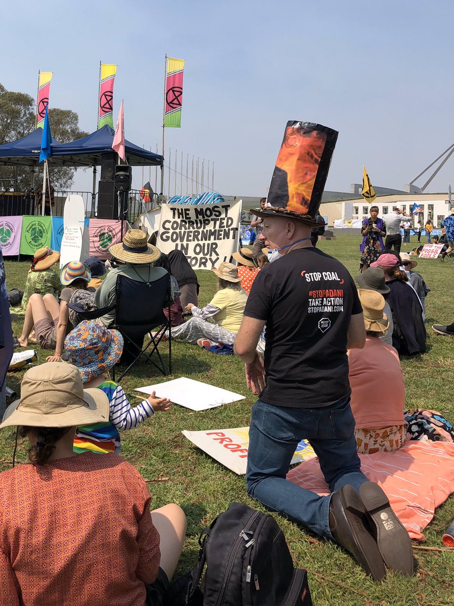 Julian_Wigley's tweet photo. Moments on the grass #PeoplesClimateAssembly #Feb4FireFury Canberra Parliament rally. 

People adapting🙃 mourning loss, thanking the firies and taking action for change.
#auspol https://t.co/CycADD1sX2