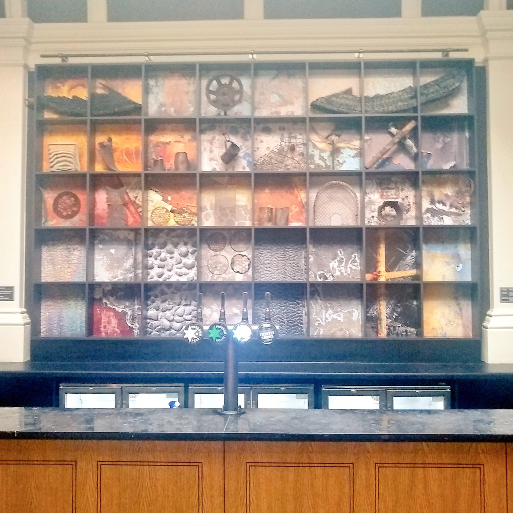 The decoration behind the bar is made from parts of the building recovered from a fire and photos of the fire damage