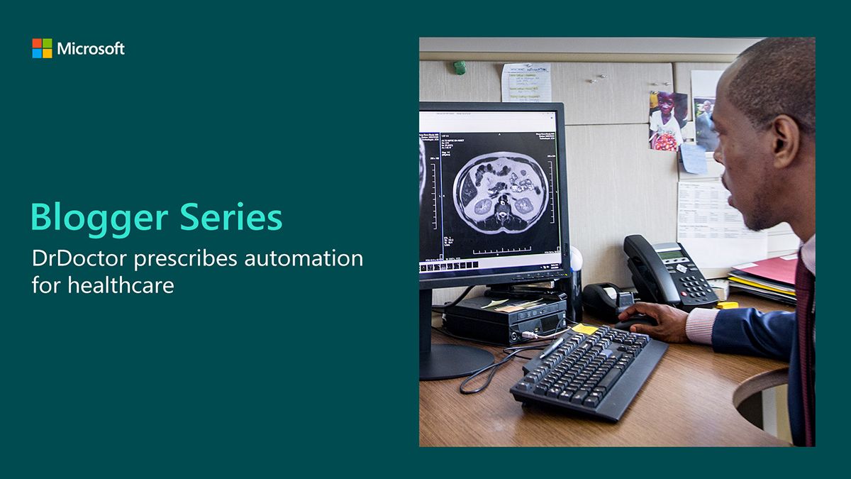 A man is using a desktop computer, looking at a CT scan on a monitor. 