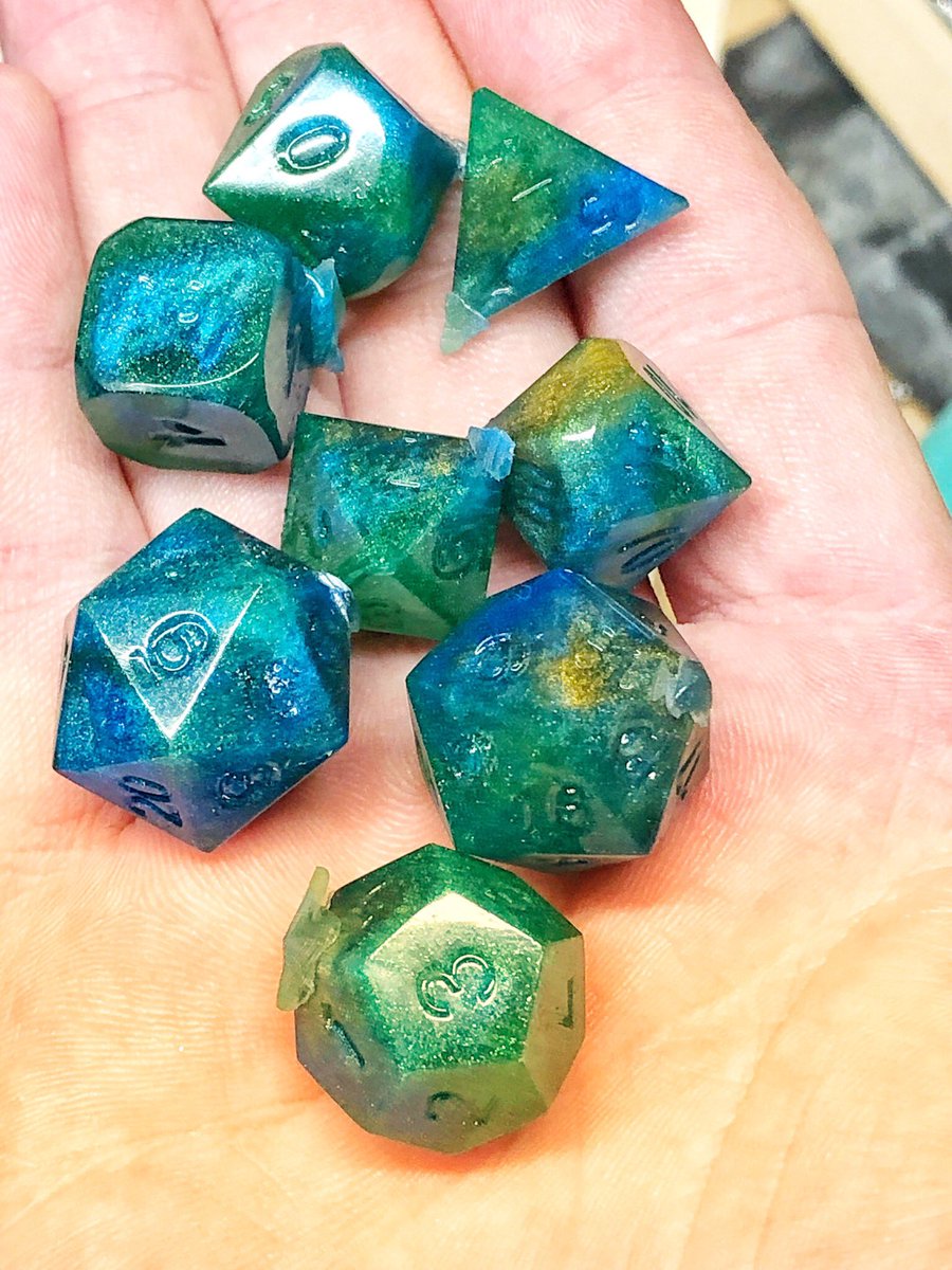 AlkeshOne's tweet photo. When someone asks you to make them a set of peacock dice, only the finest blues, greens, and golds will do. WIP, unsanded, unpolished, and uninked.
#resindice #handmadedice #resin #dice #dicegoblin #dnd #dnddiceset #dnddice #diceset #polyhedradice #resinart #dicemaking https://t.co/VbVDSo98gH