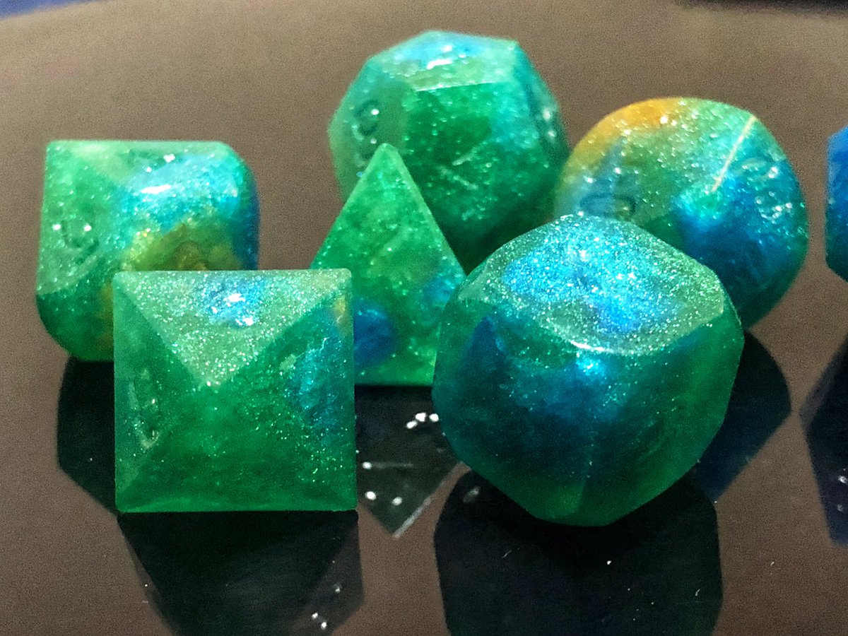 AlkeshOne's tweet photo. When someone asks you to make them a set of peacock dice, only the finest blues, greens, and golds will do. WIP, unsanded, unpolished, and uninked.
#resindice #handmadedice #resin #dice #dicegoblin #dnd #dnddiceset #dnddice #diceset #polyhedradice #resinart #dicemaking https://t.co/VbVDSo98gH