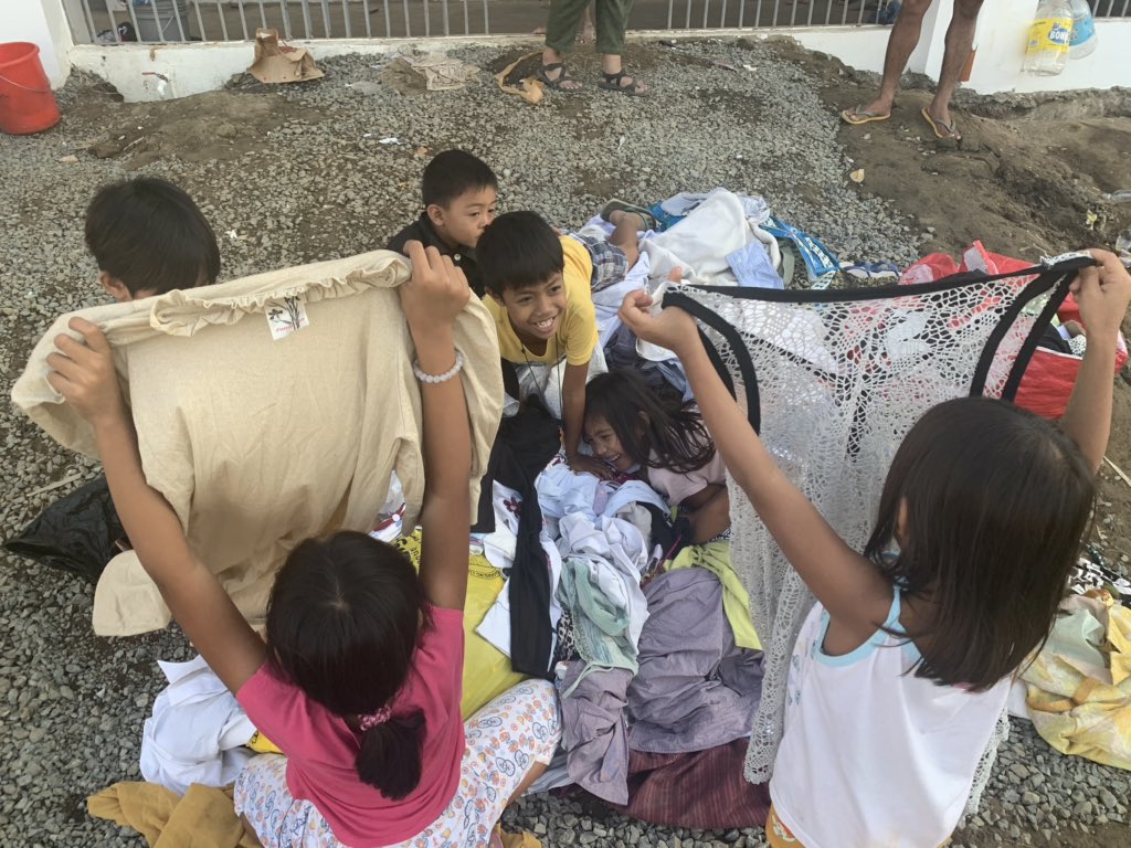 While most of Taal evacuess had already gone home, families from Pulo have permanently lost their homes on the island. A group of kids from Brgy Alas-as, San Nicolas town pick from a pile of donated clothes in an evacuation center in Ibaan, Batangas @InquirerSLB