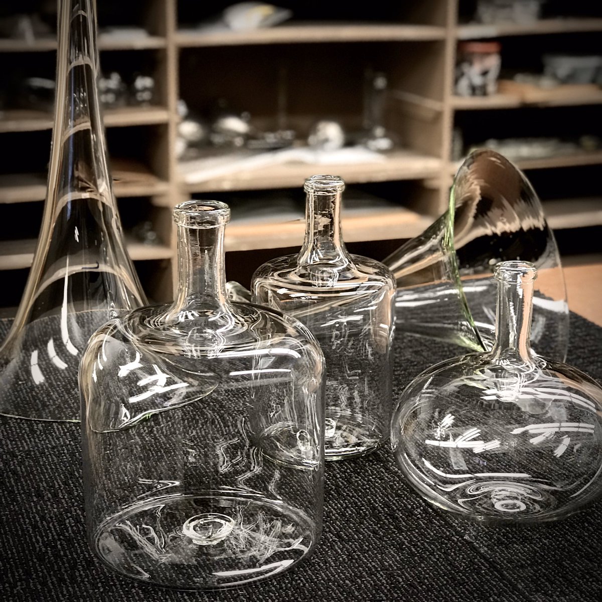 JonCappsGlass's tweet image. Another day at the office! Finished up some #handmade #glassart bottles, and #prototyping #gramophone trumpet horns!