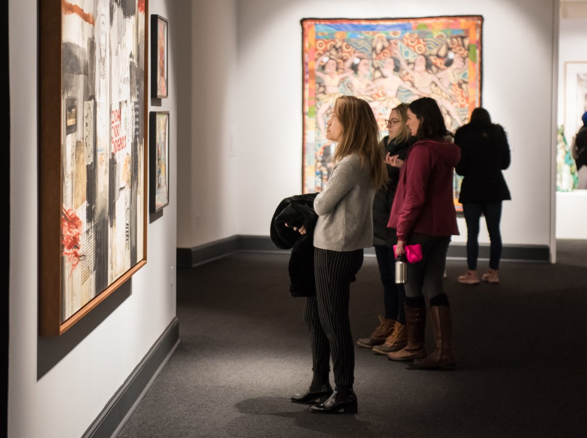 People gazing at art in a NMWA gallery.