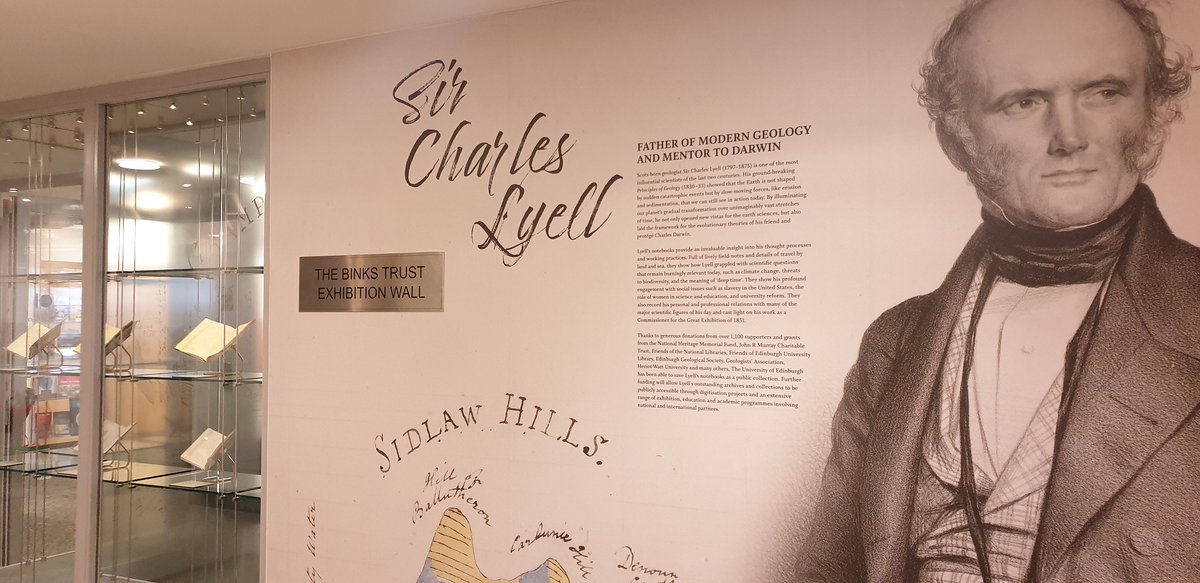 Image is a photo of the introduction to the Charles Lyell exhibition which includes a large reproduction of a drawing of Lyell and introductory text about Lyell.