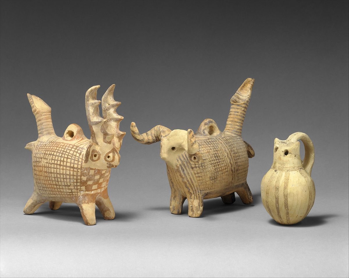 ‪A group of Cypriot terracotta zoomorphic askoi (vessels) ~ c. 1725–1600 BCE‬. Left to right: deer, ram, and cat.