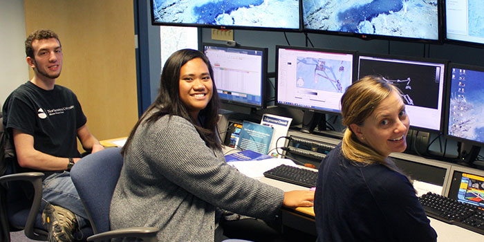 Explorer-in-Training Claudia Thompson with NOAA Office of Ocean Exploration and Research mapping lead Elizabeth "Meme" Lobecker and fellow Explorer-in-Training Brandon O'Brien at work at the University of New Hampshire's Center for Coastal and Ocean Mapping.