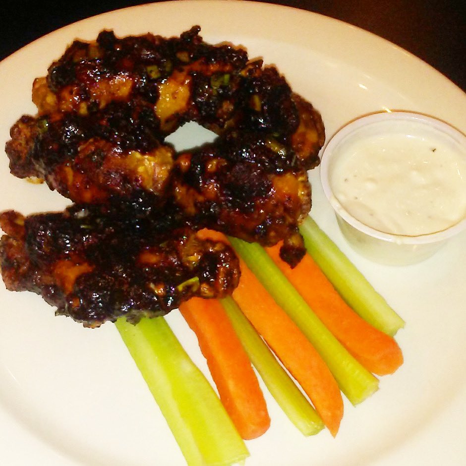 JERK JAMAICAN WINGS — fresh fried chicken wings and drummettes tossed in a sweet style Jamaican Jerk bbq sauce and green onions, served with your choice of dipping sauce $10