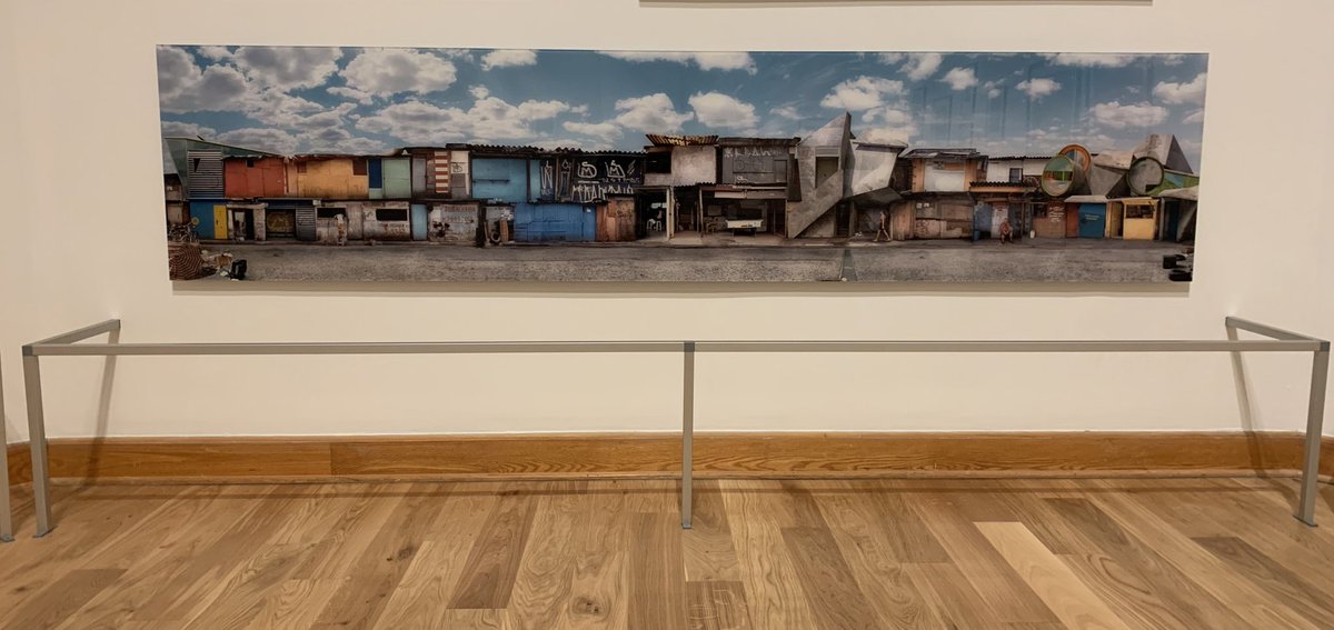 kmpmurphy's tweet photo. A curator creates a salon wall of expansive landscape photography. Collections management comes along and fences it in for no discernible reason (all glazed, no loan requirenents). We must fight overstanchioning to our last breath. The struggle is real. #curatorproblems https://t.co/KkPDbOI34R