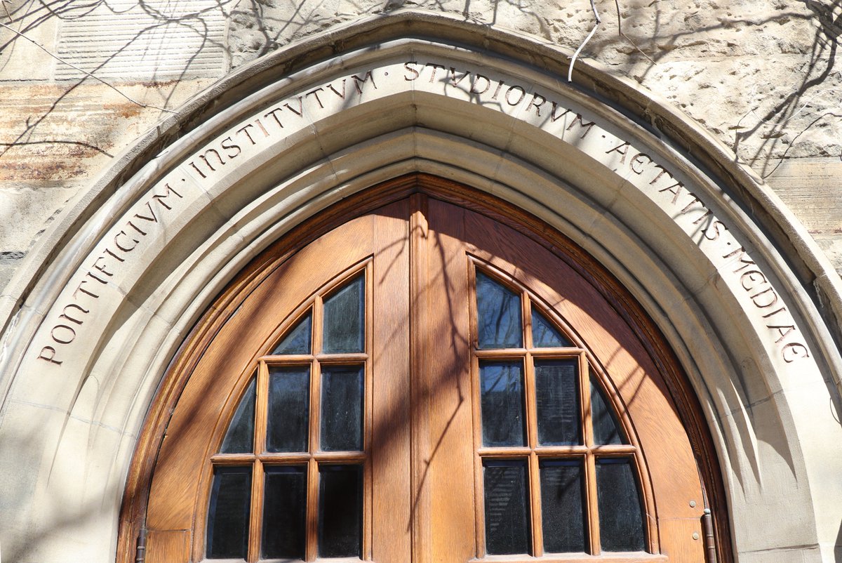 An arch over the entrance doorway to the Pontifical Institute of Mediaeval Studies on the St. Michael's campus. 