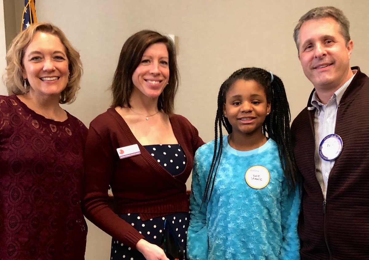 HearingYourBest's tweet image. Dr. Tim Steele, his wife, Julie, and their daughter Kate, surprised, Jamie, a social worker from the Kansas Children's Service League, with a reunion at the Overland Park Rotary meeting Jan. 27.  Jamie helped the Steeles adopt Kate 11 years ago, and she hadn't seem them since.