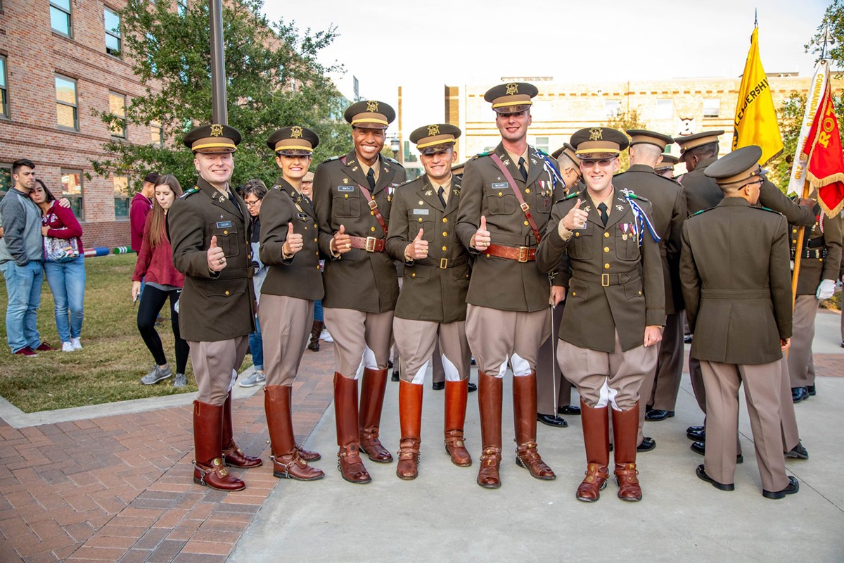 cadets standing together gigging em on the quad