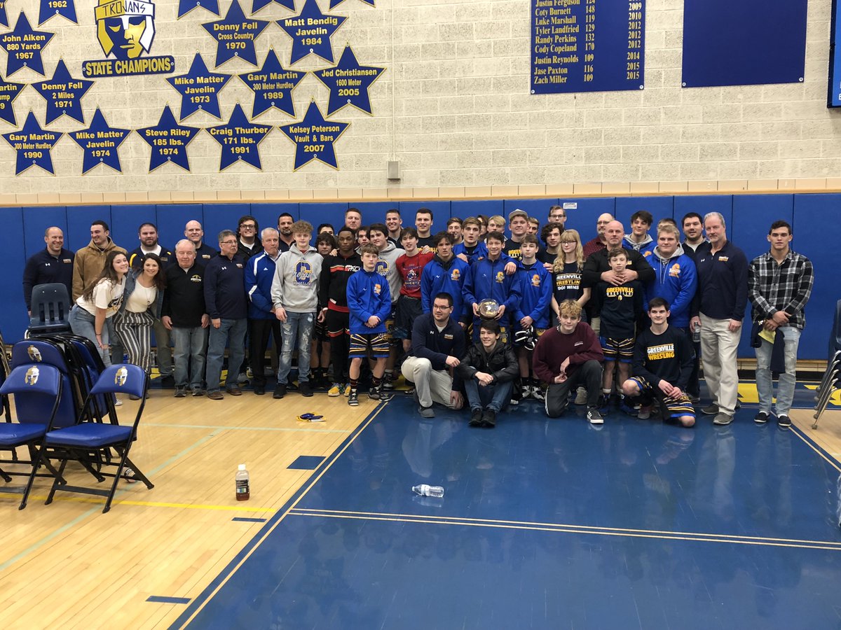 Past and present Trojan Wrestlers and Coaches gather to celebrate the Program's 900th win on January 28, 2020, a 60-13 victory over Slippery Rock HS.