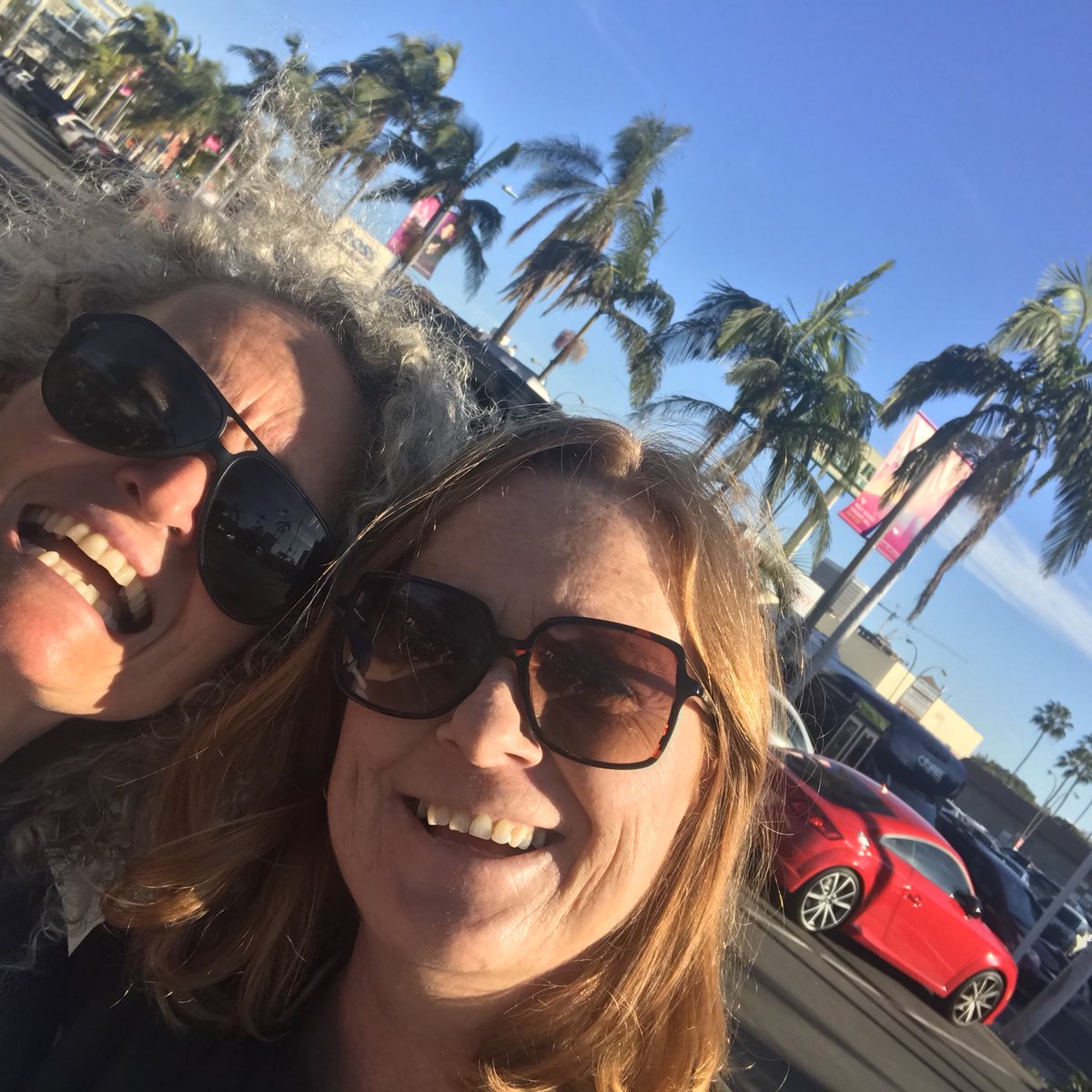 The BBC legend @bbckirstylang and me trying to get an “LA shot” (read: palm trees) outside the Writers Guild of America @WGAWest