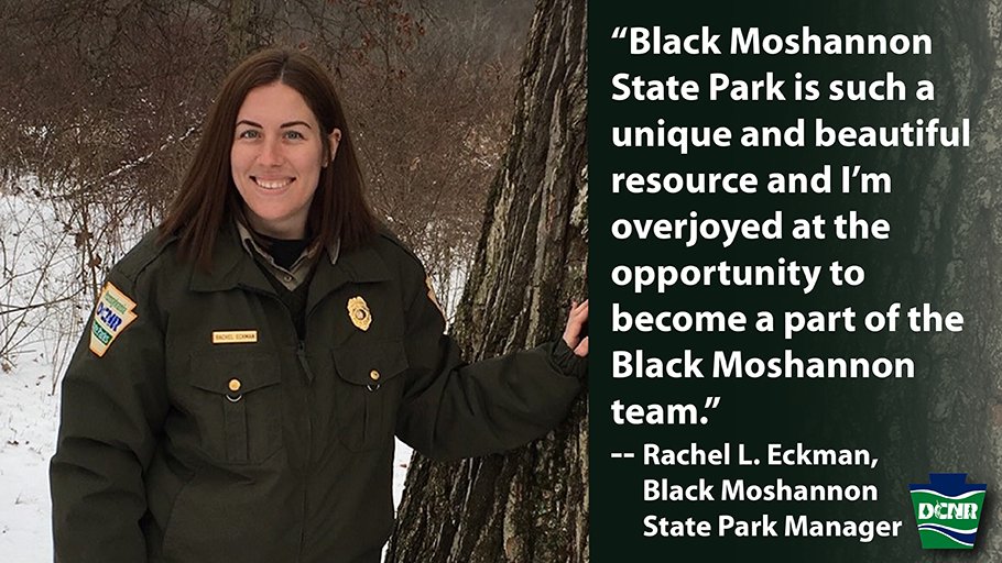 Rachel Eckman stands next to tree in snowy forest in state park uniform and is quoted saying, “Black Moshannon State Park is such a unique and beautiful resource and I’m overjoyed at the opportunity to become a part of the Black Moshannon team.” DCNR logo.