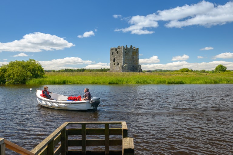 View of Threave Castle and the boat on the River Dee