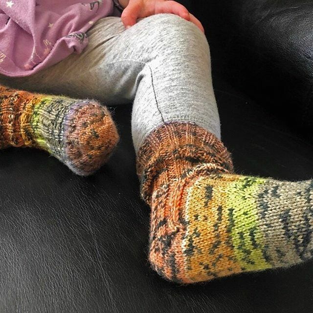 AprilKlich's tweet photo. The kiddo got her first pair of hand knit socks a few days ago. I made with them with the expectation that she'd ditch them under the furniture like every other pair of her socks, but she actually likes them! She brings them over to me so I can put them … https://t.co/ckJpR55fnX https://t.co/NBAnoqHCZG