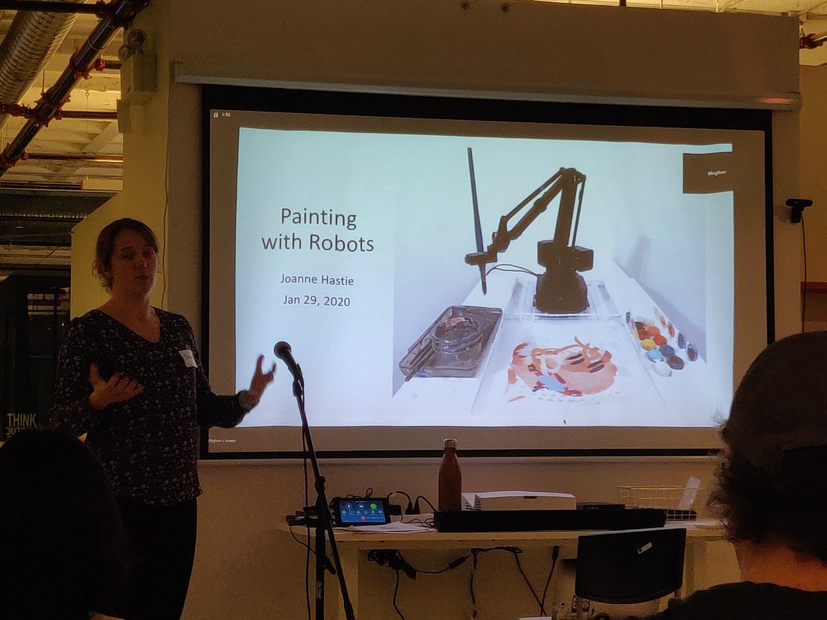 Presentation called Painting with Robots and the woman presenting