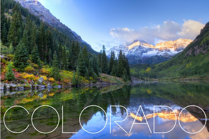 Picture of the Colorado Rocky Mountains with a river and evergreens