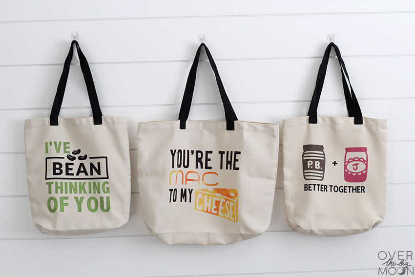 OvertheBigMoon's tweet photo. FOOD PUN GROCERY TOTES---- > Learn how to make Infusible Ink Totes using these fun Food Puns!! Find the tutorial here: https://t.co/ON9tD59kUG @OfficialCricut #InfusibleInk #CricutCause #CricutCreated #CricutMade #Cricut https://t.co/AeVAO9zOwd