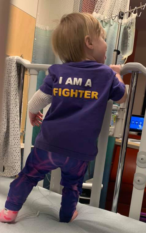 Gracie wearing a shirt that reads, "I am a fighter".