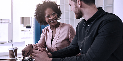 Photo of a man and woman working together