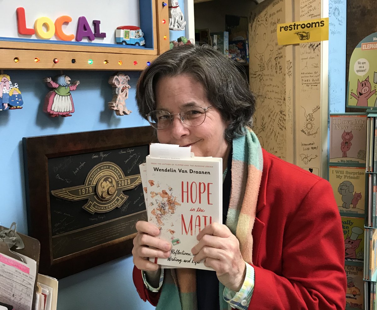 The sign above says it all: 'shop local' especially at @Hicklebees! The gleeful grin, @WendelinVanD, is imagining booking more people with #HopeInTheMail!