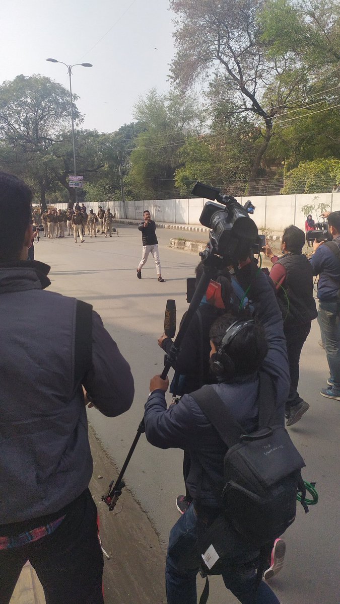 SalmanNizami_'s tweet photo. #SOSJamia- BJP's Minister says Goli Maro Salon Ko. Next day a Goon turns up wd a gun at Shaheen Bagh &amp; today anothr Goon opened fire at protesters in Jamia while police remain mute spectator. This is what happens whn violence is normalised. This is both unacceptable &amp; outrageous! https://t.co/NHr3N2wiel