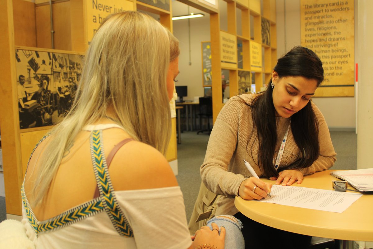 Keyworker working with a young participant.