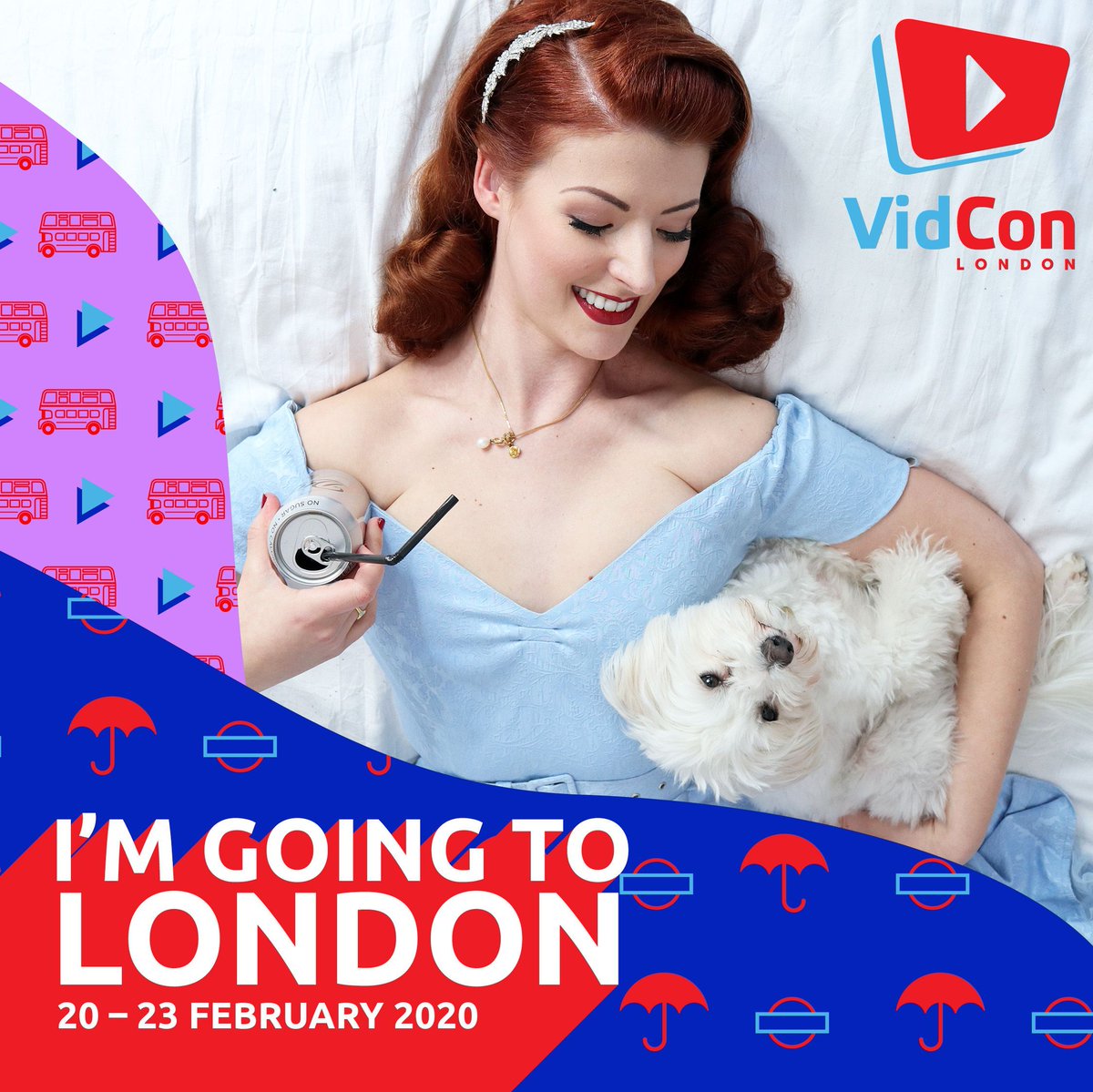 Jessica and Tilly laid on a bed, Tilly is looking at the camera and Jessica is looking at Tilly. Jessica is wearing a light blue dress and holding a can of Diet Coke. Words say 'I'm going to London. 20 - 23rd February 2020.