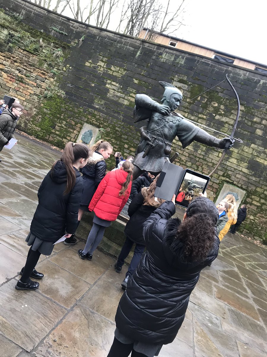 MissStimson's tweet photo. We’ve had a pit-stop and Imogen has been placed in the stocks! We even had a visitor from Robin Hood before visiting his statue. Ask year 5 about why he has a statue in Nottingham! @WhitegateSch @MissNoelWG #ExploreNottingham https://t.co/v1PJkVc4xI